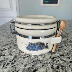 Vintage Ceramic Kitchen Canister with Grape Design and Wooden Spoon